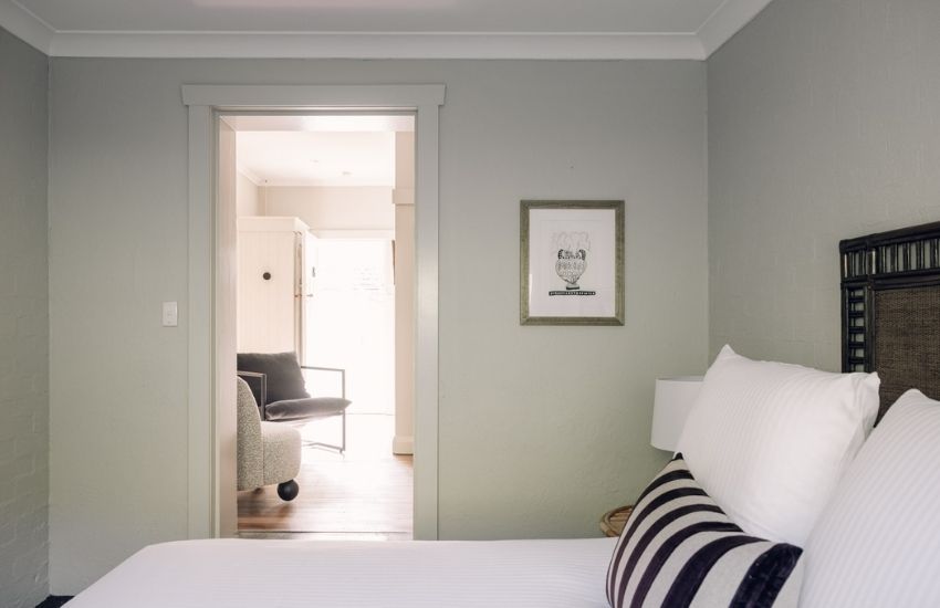 bright links house bedroom featuring minimalist decor and comfort