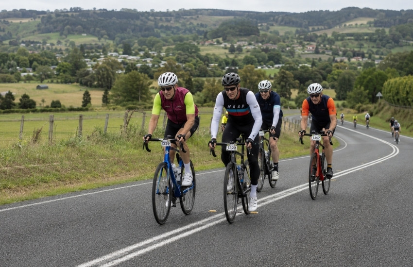 Cyclists climbing a country road through the Southern Highlands during the Bowral Classic