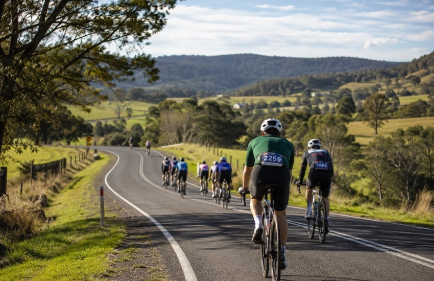 Cyclists riding through the rolling countryside during the 120 km Bowral Classic route